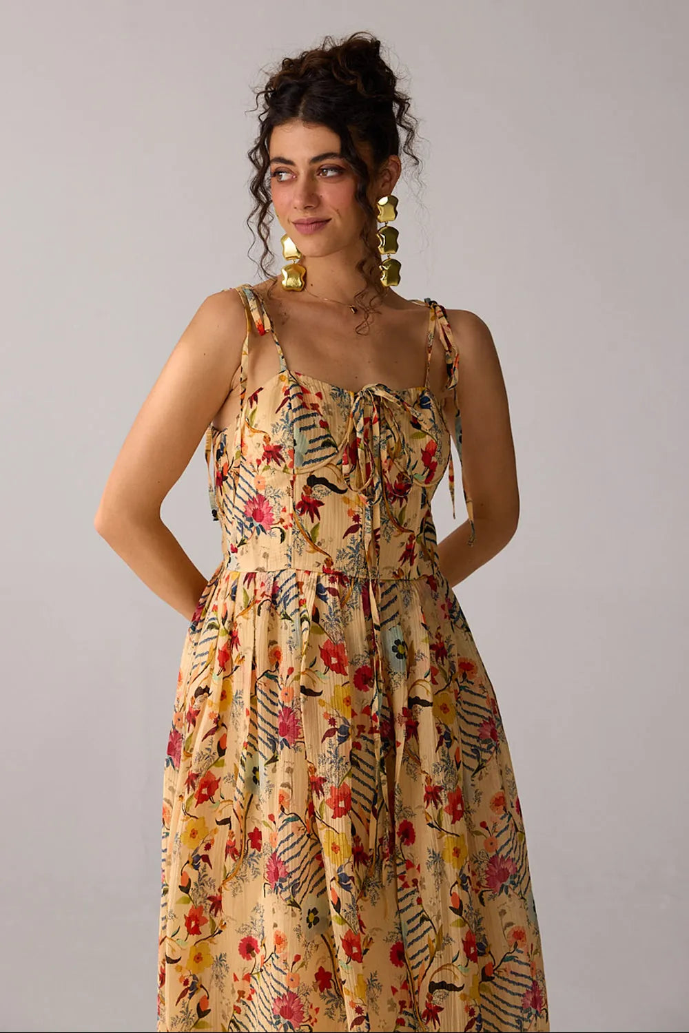 Dixie Dress women's beige chiffon maxi dress featuring a corset-fitted bodice, an elegant flowing skirt and an adjustable smocked back for a flattering fit, styled for summer getaways, resort dinners, luncheons and special occasions.