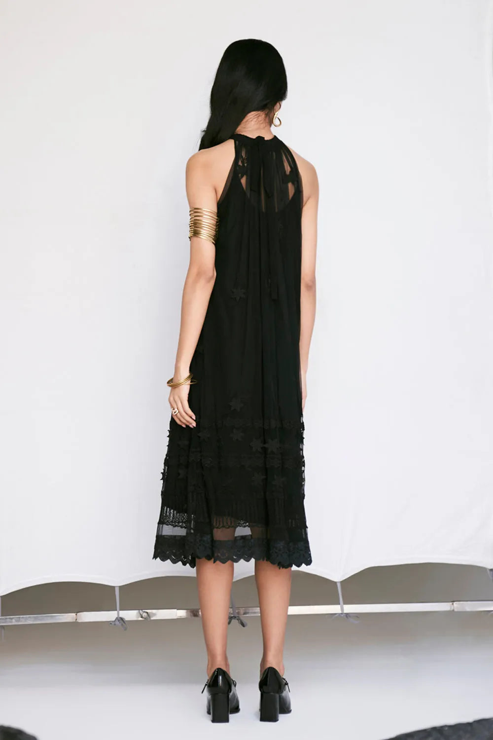 Edda Dress women's black tulle dress featuring a contemporary silhouette and elegant sheer-textured fabric, designed for a sophisticated statement look, styled for festive evenings, cocktail gatherings, vacation outings and special occasions.