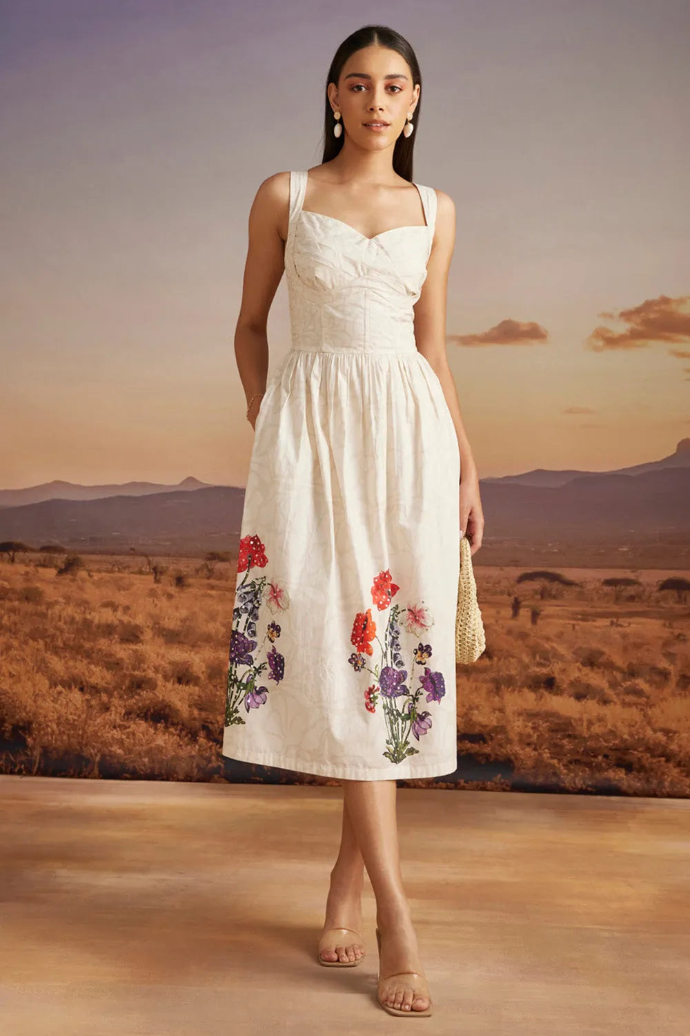 Emery Dress women's beige cotton dress featuring a sweetheart neckline, delicate bead detailing and a floral print with a feminine 50-inch silhouette, styled for summer brunches, resort vacations, garden parties and special occasions.