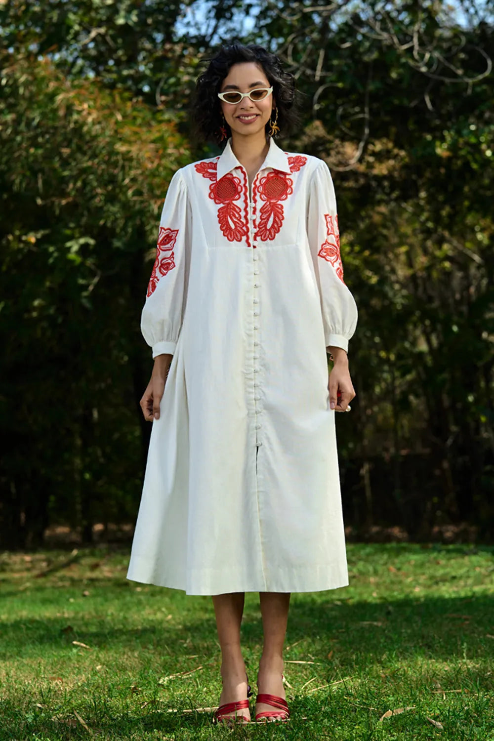 Ivar Embroidered Dress women's ivory cotton midi dress featuring intricate pearl cutwork embroidery on the sleeves, a relaxed silhouette and elegant handcrafted detailing, styled for summer brunches, daytime celebrations, garden gatherings and sophisticated casual occasions.