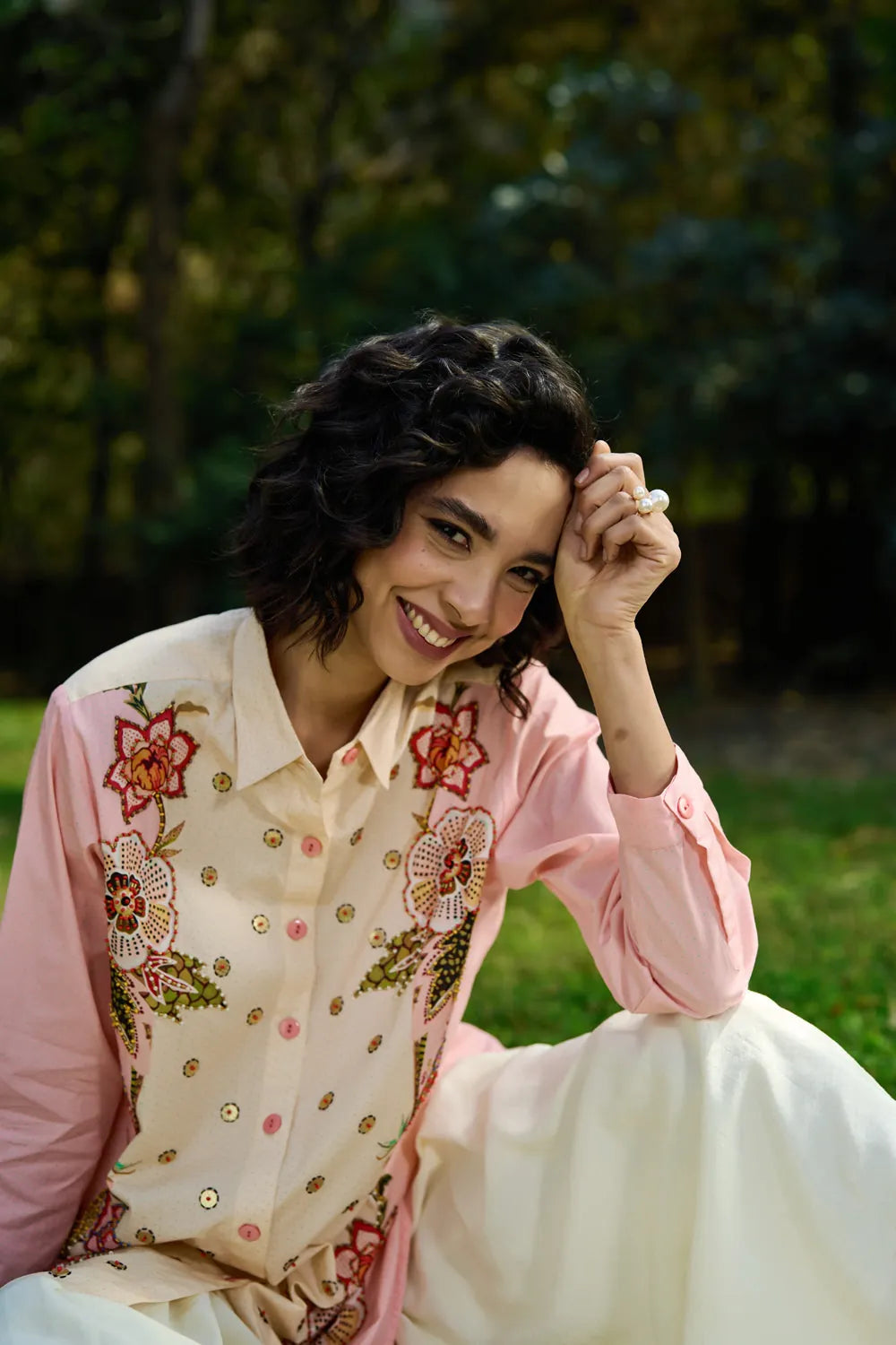 Keyla Shirt women's pink and cream cotton shirt featuring a bold colour-blocked floral print, vibrant contrasting hues and a relaxed longline silhouette, styled for summer holidays, resort outings, casual brunches and statement everyday dressing.