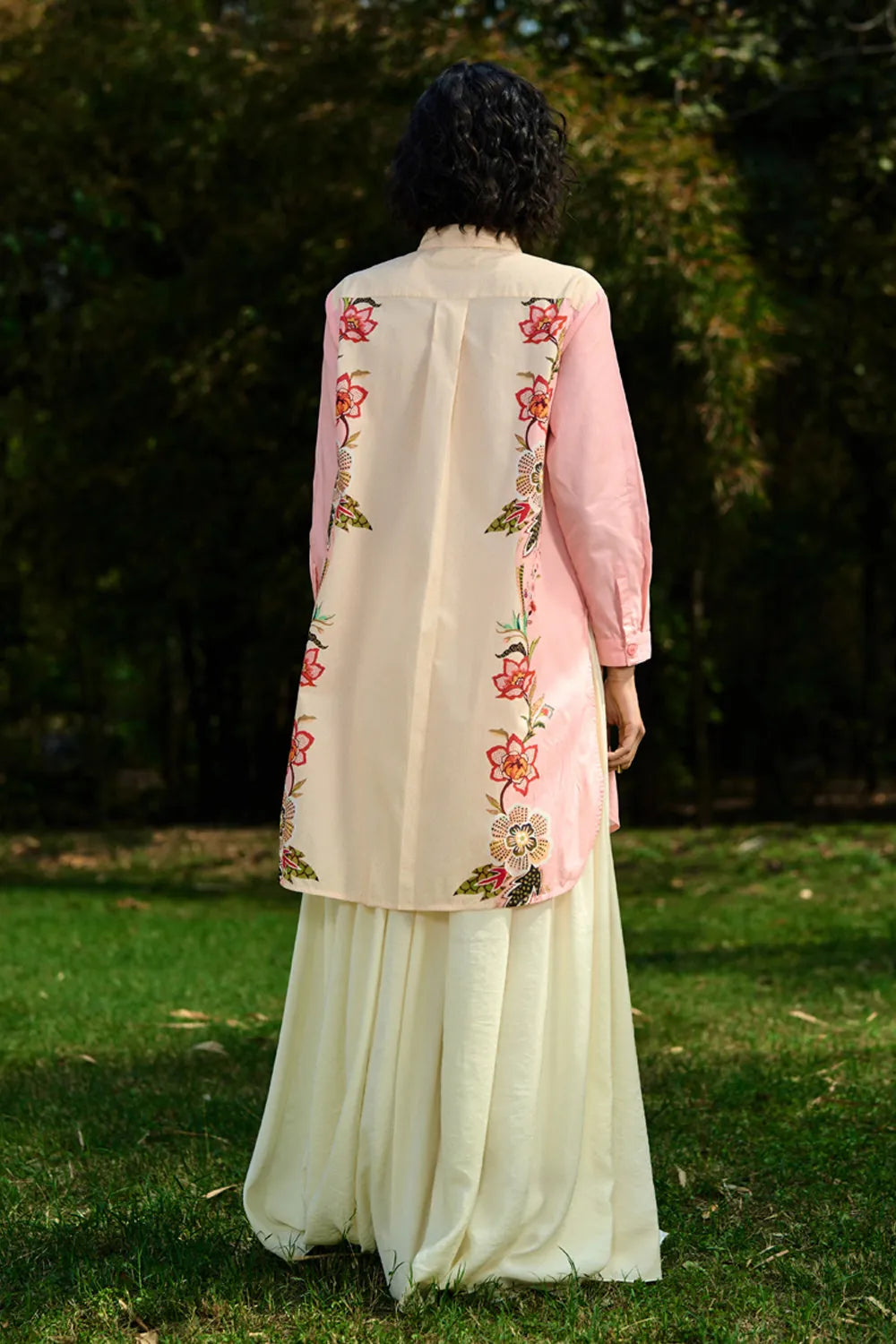 back view of Keyla Shirt women's pink and cream cotton shirt featuring a bold colour-blocked floral print, vibrant contrasting hues and a relaxed longline silhouette, styled for summer holidays, resort outings, casual brunches and statement everyday dressing.