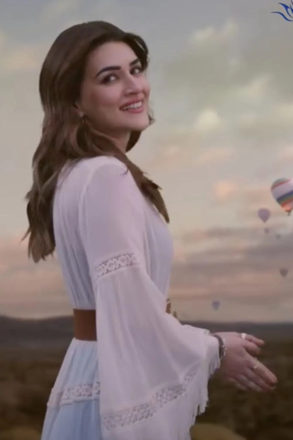 Kriti Sanon wearing the Femi Cape With Shorts, a women's ivory chiffon co-ord set featuring a flowing cape with delicate lace detailing and matching shorts with lace accents, styled for beach holidays, resort vacations, poolside gatherings and elegant summer getaways.