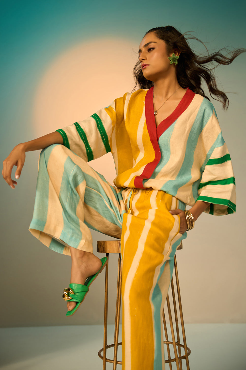 Leni Pants women's multicolour pants featuring a vibrant striped pattern and relaxed, flowing silhouette, designed for comfortable statement dressing, styled for resort vacations, summer outings, brunches and casual everyday wear.