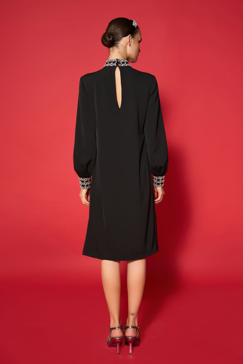 back view of Levy Embroidered Dress women's black embroidered dress featuring intricate decorative detailing and an elegant contemporary silhouette, styled for evening celebrations, resort dinners, festive gatherings and special occasions.