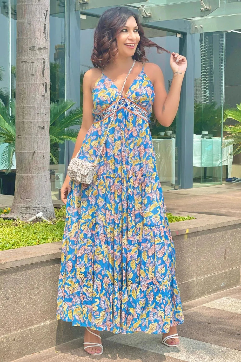 Malini Agarwal wearing the Insia Spaghetti Dress, a women's cobalt blue viscose georgette maxi dress featuring a vibrant multicolour print, delicate spaghetti straps and a flowing 54-inch silhouette, styled for summer holidays, beach getaways, resort evenings and destination celebrations.