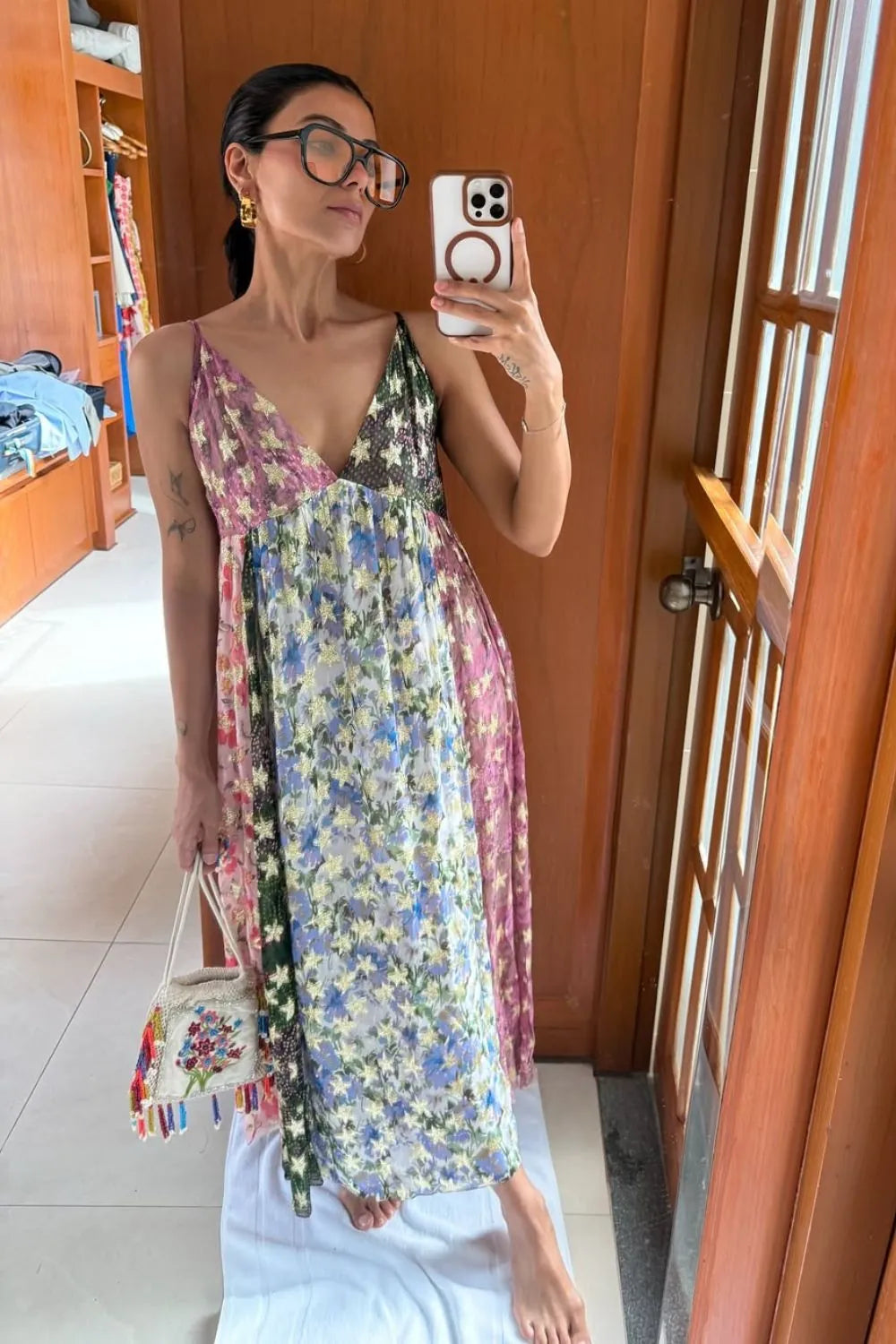 Nriti Shah wearing the Irida Spaghetti Dress, a women's multicolour Viscose Lurex Georgette maxi dress featuring a jacquard printed colour-blocked design, delicate spaghetti straps and shimmering fabric with a flowing silhouette, styled for resort vacations, festive evenings, holiday getaways and special occasions.