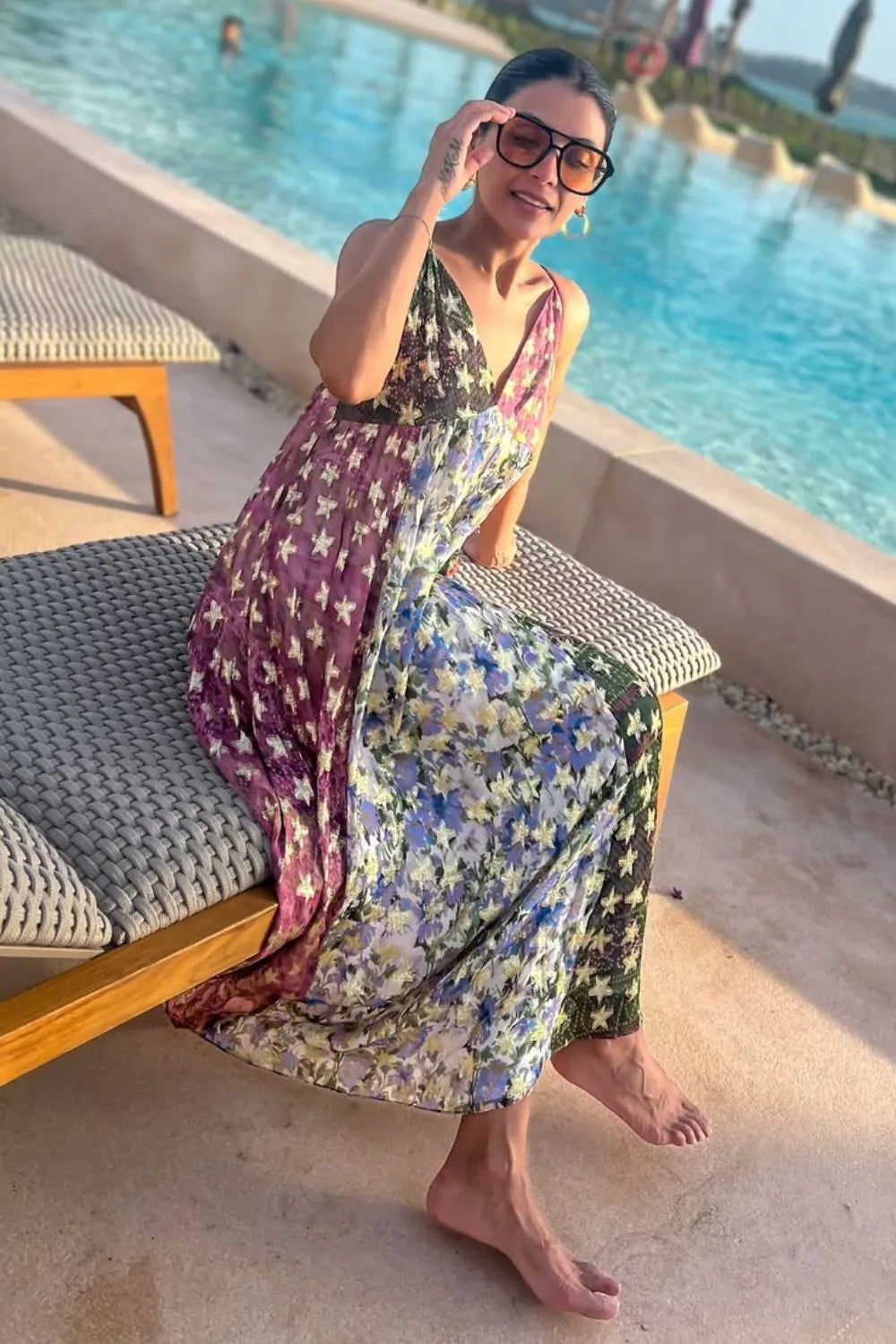 Nriti Shah wearing the Irida Spaghetti Dress, a women's multicolour Viscose Lurex Georgette maxi dress featuring a jacquard printed colour-blocked design, delicate spaghetti straps and shimmering fabric with a flowing silhouette, styled for resort vacations, festive evenings, holiday getaways and special occasions.