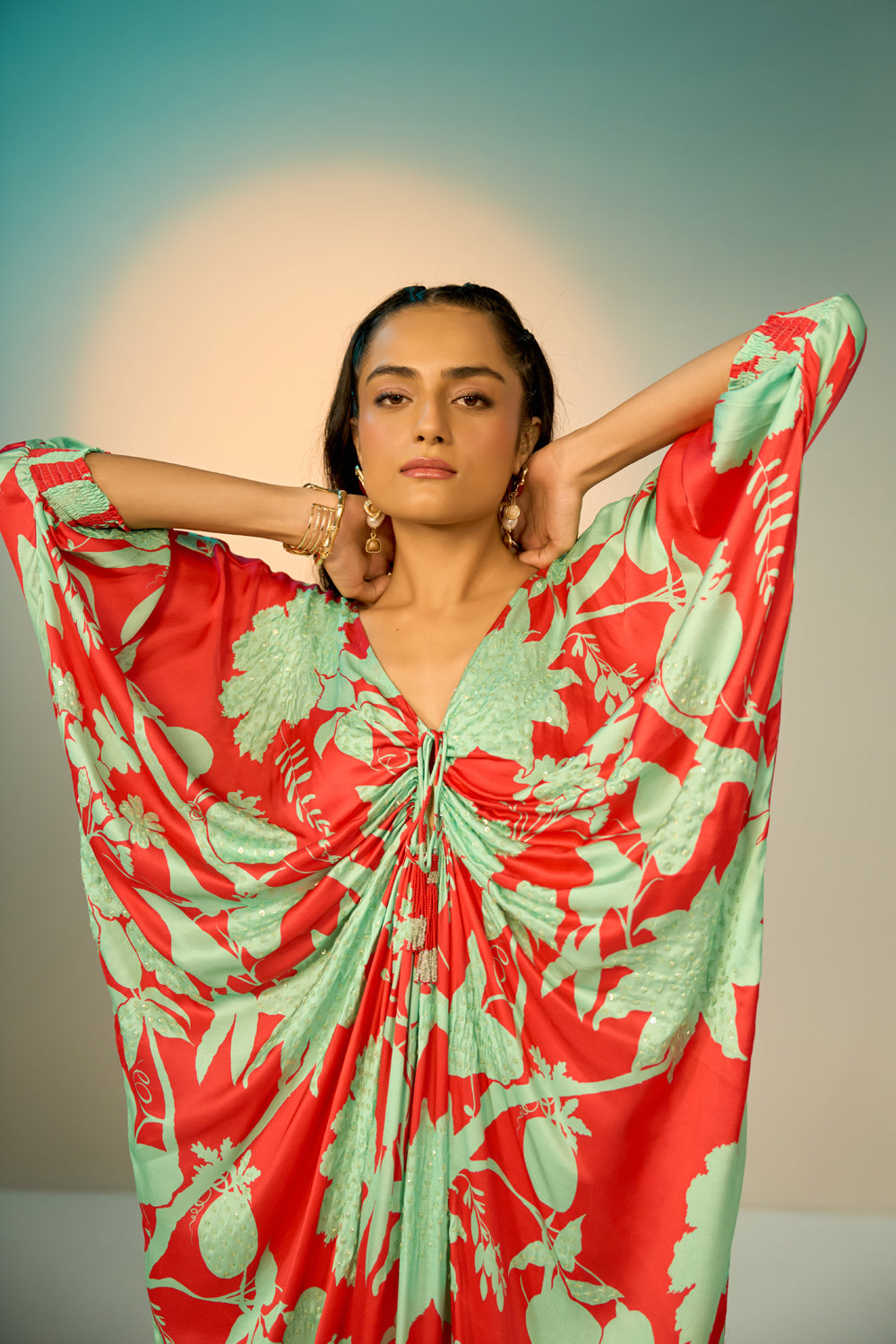 Closeup look of Red Lotus Kaftan women's kaftan featuring a flowing, relaxed silhouette and statement lotus-inspired design, styled for beach holidays, resort vacations, poolside lounging and elegant summer getaways.