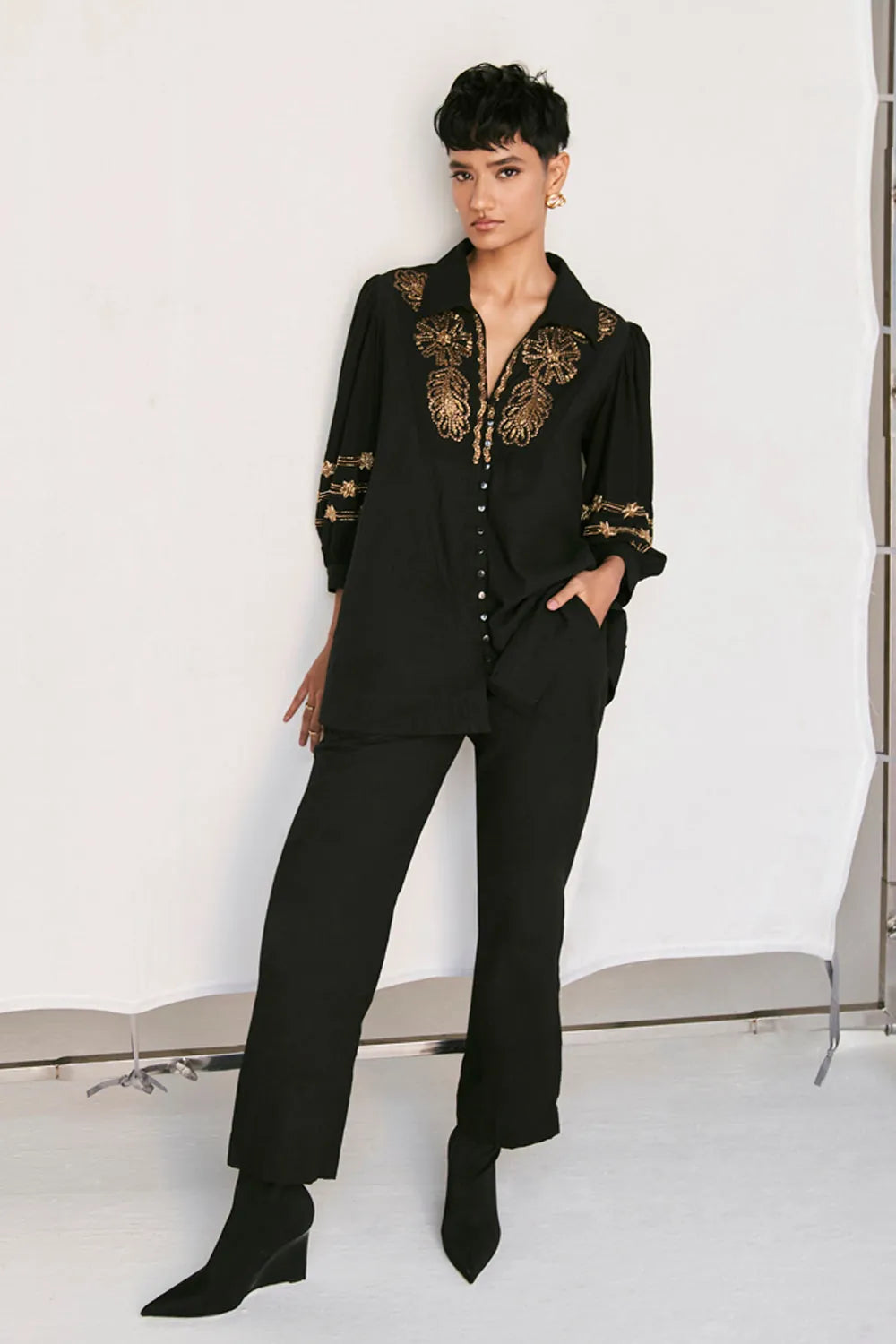 Full view of Rimi Shirt women's black cotton shirt featuring a relaxed silhouette, classic collared neckline, button-down front and clean contemporary styling, designed for comfortable everyday wear, styled for casual outings, travel days, brunches and smart-casual occasions.