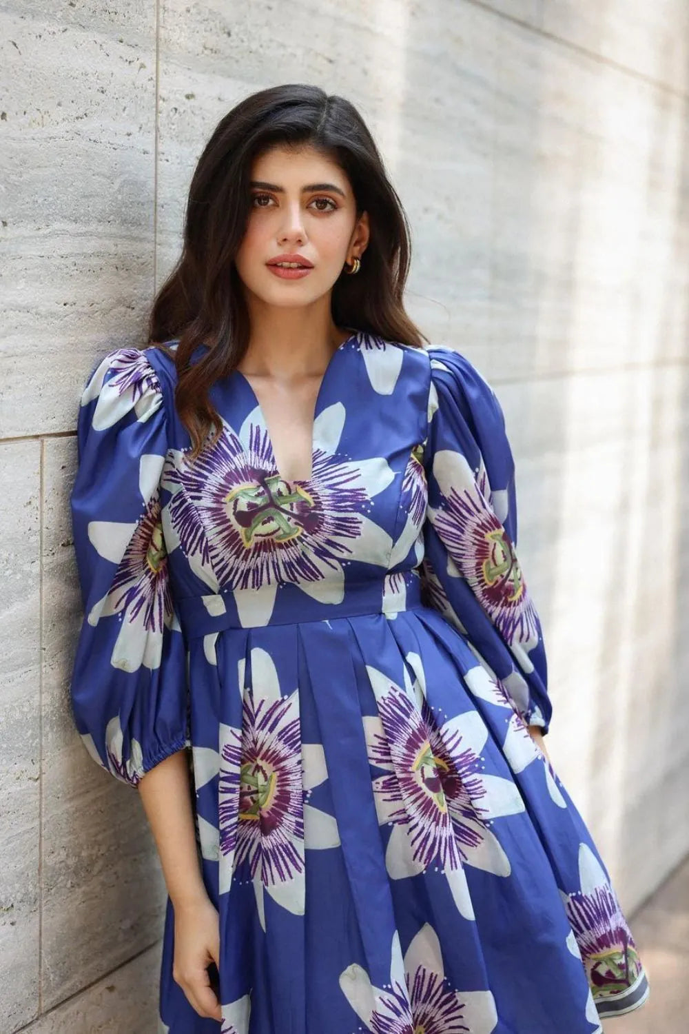 Sanjana Sanghi wearing the Amara Mini Dress, a women's cobalt blue cotton satin mini dress featuring a vibrant printed design and a relaxed swing silhouette, styled for summer outings, brunches, resort vacations and casual celebrations.