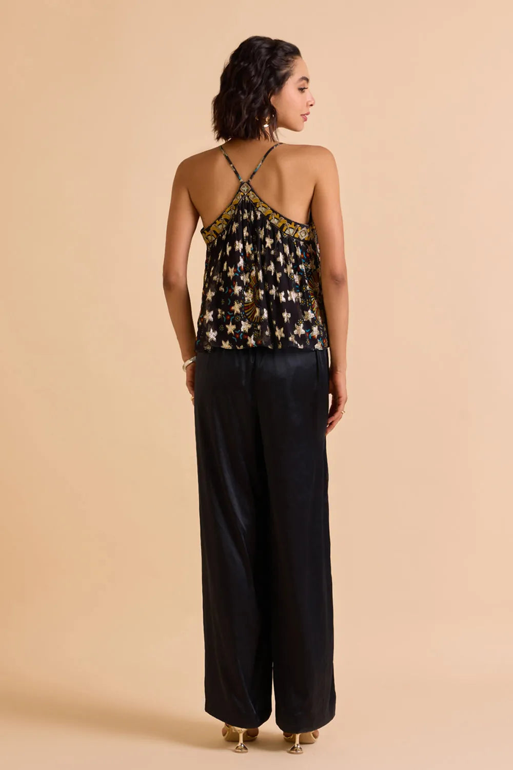 Back view of Xena Beaded Blouse women's statement blouse featuring intricate bead embellishments and a contemporary silhouette, designed to add texture and detail to coordinated outfits, styled for festive gatherings, resort evenings, cocktail events and special occasions.