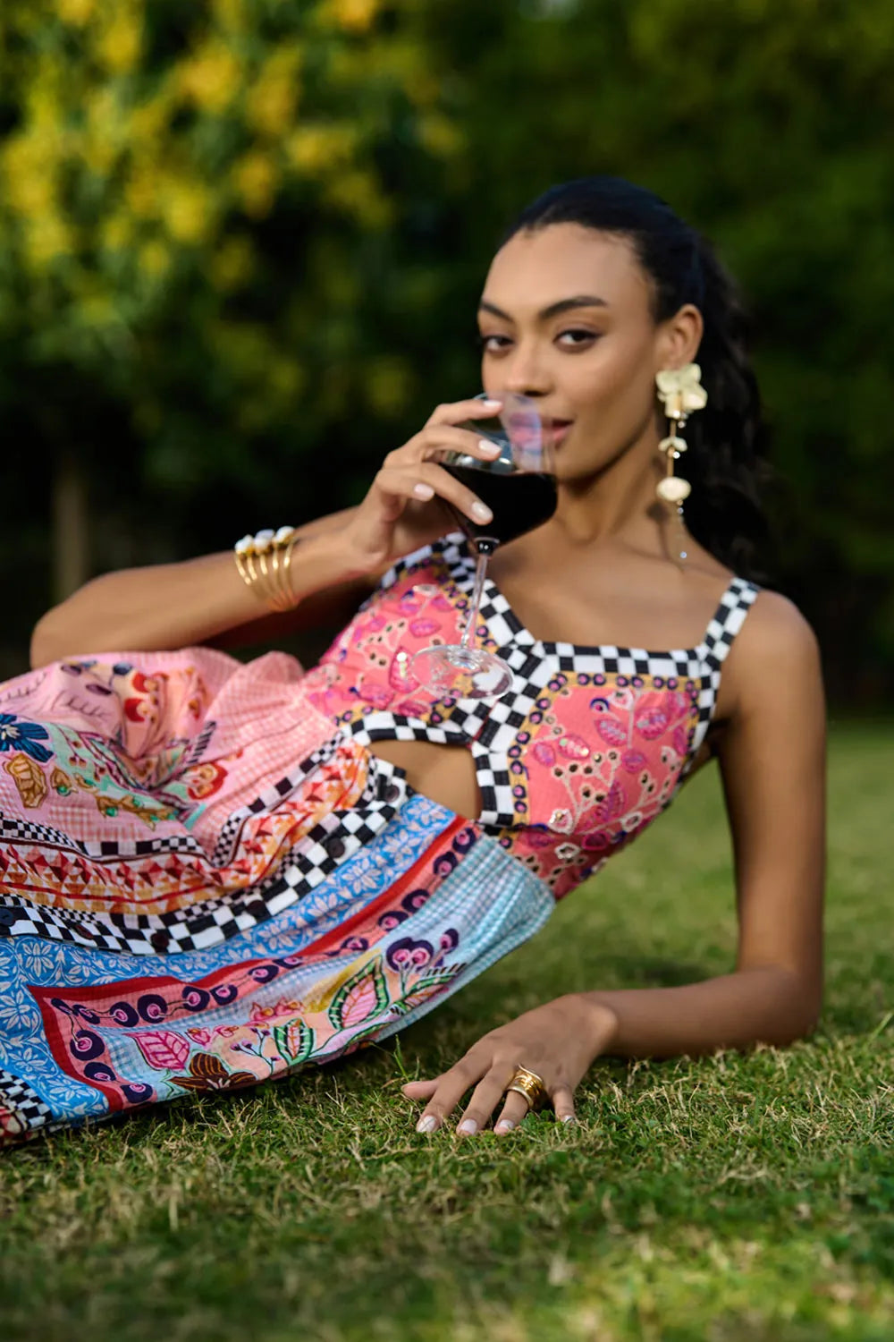 Aarna Beaded Spaghetti Women's pink printed sleeveless maxi dress with checkerboard trim and vibrant bohemian pattern, styled for resort vacations, summer holidays and brunch outings.