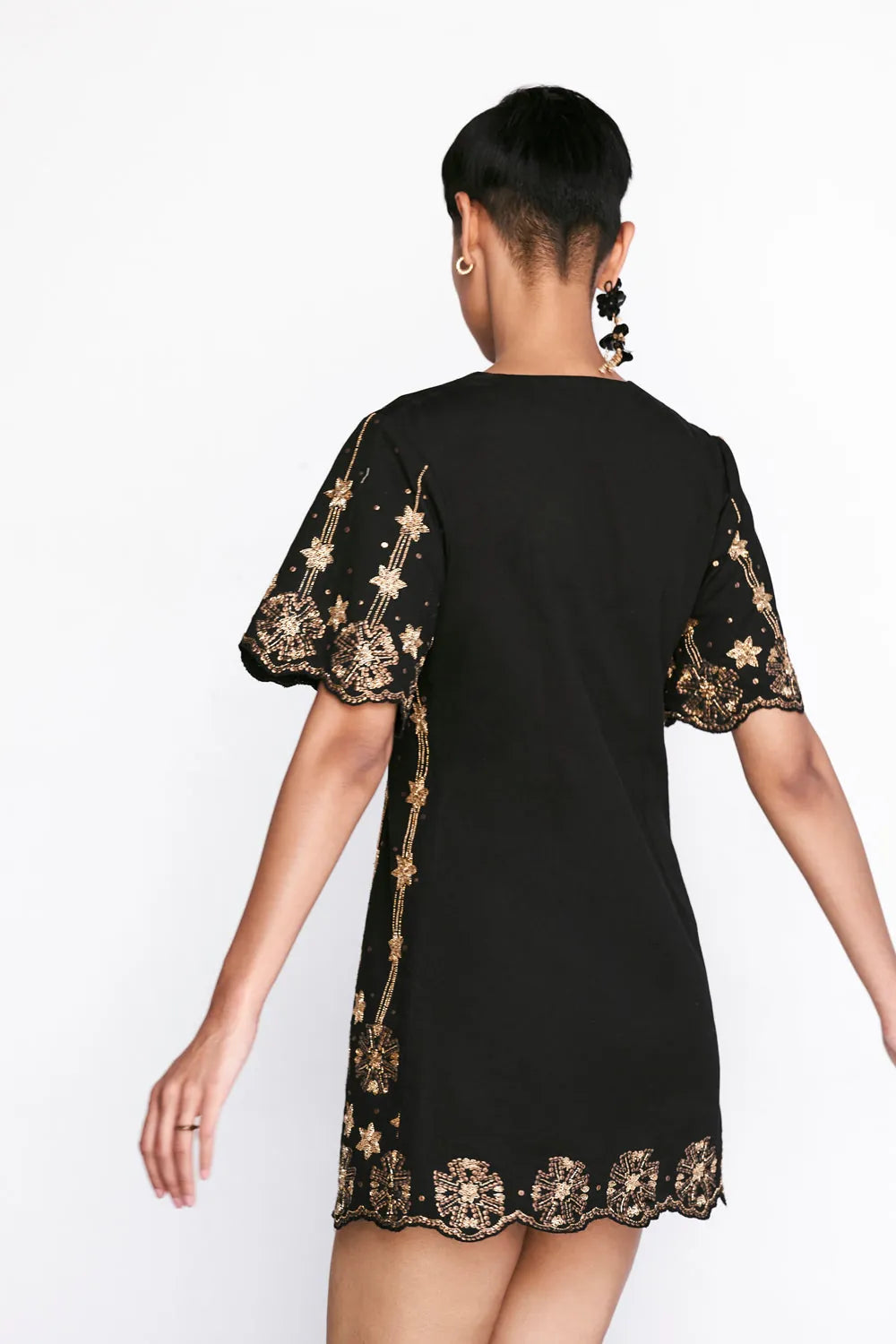 Back view of Aira Mini Dress in black with mini silhouette perfect for brunch outings, vacation evenings, and celebrations for women.