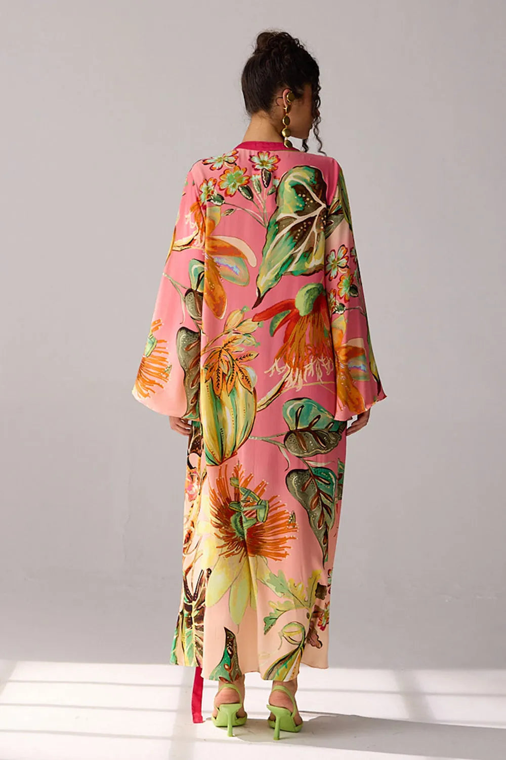 Back view of Alani a pink ombre Dress with double georgette maxi and flare sleeves, and silhouette, perfect for day-to-evening styling.