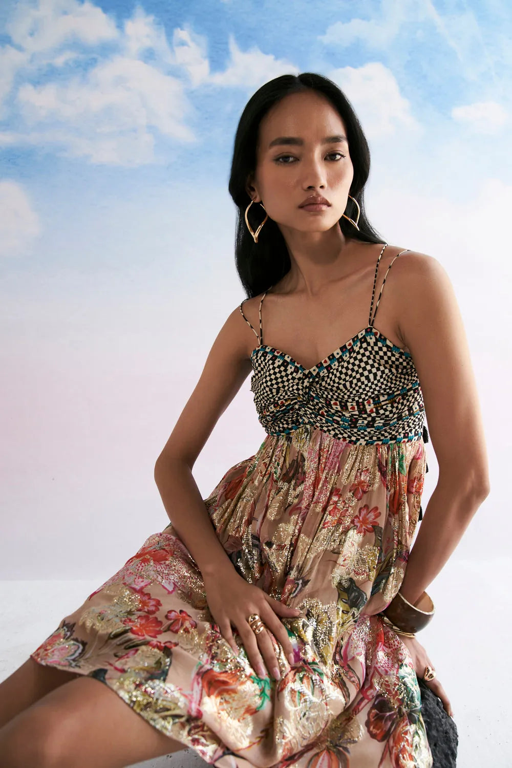 Anvena Lily dress featuring a fitted embellished bodice with intricate bead detailing and a flowing floral printed skirt with a soft flared silhouette