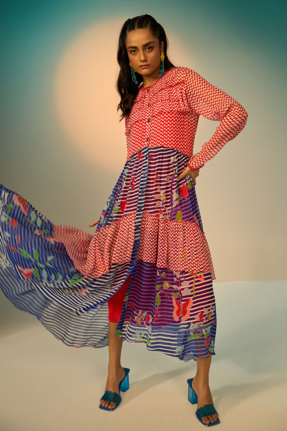 Woman wearing a red and blue striped dress with a clean background