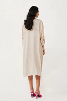 Back view of Amira Dress for woman, a beige floral dress with embroidered design, perfect for parties, date nights, and statement evening wear.