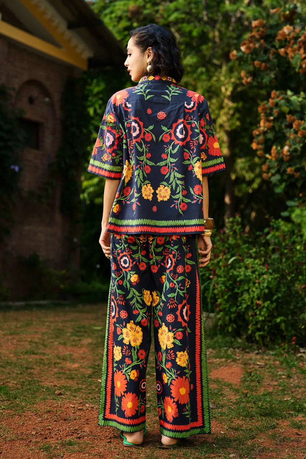 Back view of Amira shirt with pants set, a black breathable cotton embroidery with silhouette, perfect for festive styling and elevated day-to-night looks for woman.