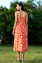 Back View of Caramine Dress Women's coral red cotton poplin dress with a feminine sweetheart neckline and flattering midi-length silhouette, styled for sunny summer days, brunches, casual outings and daytime gatherings. wearverb.com