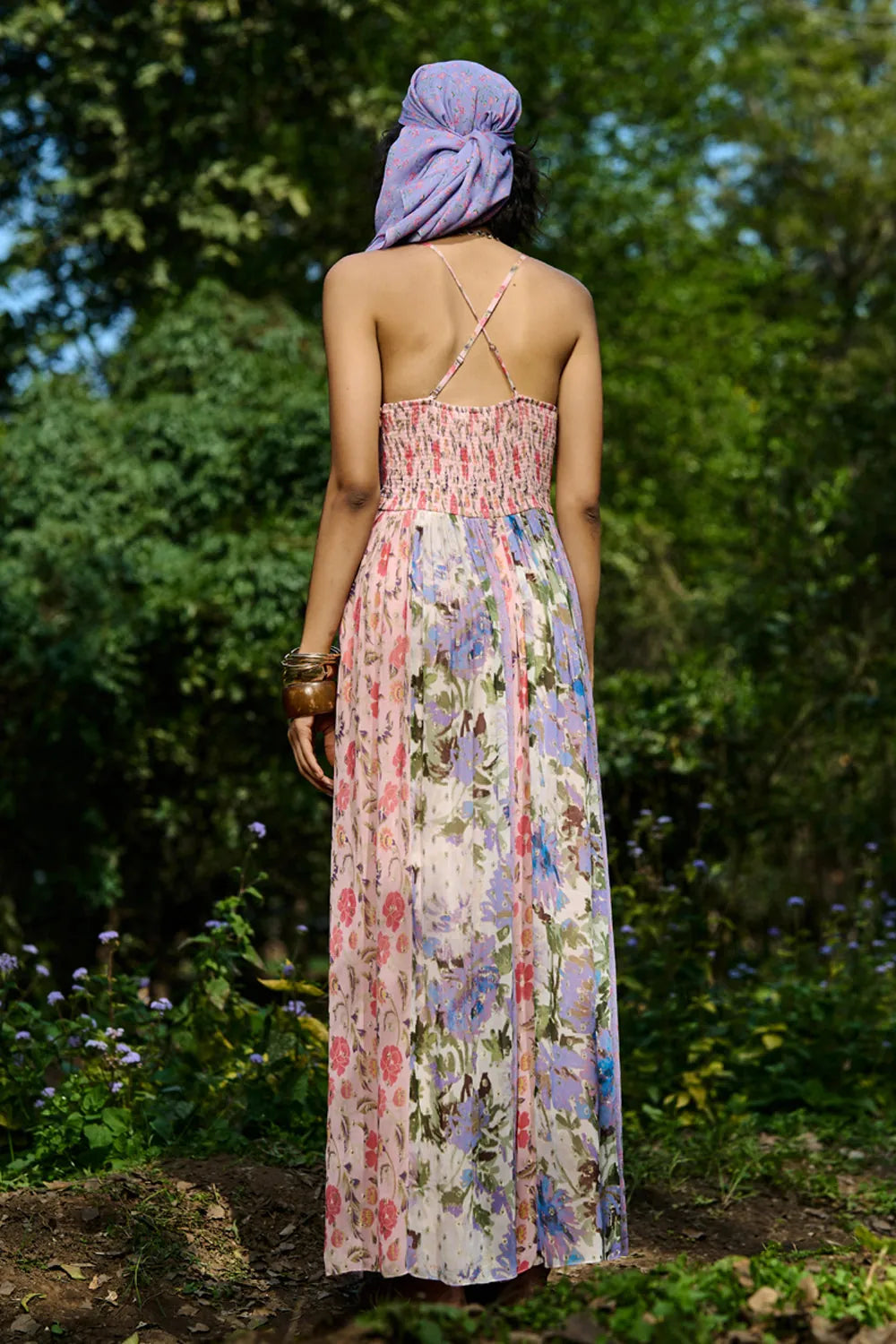 Back view of Carey Jumpsuit Women's multicolour Viscose Lurex Georgette jumpsuit featuring a romantic pink and mauve multi-printed jacquard design with a flattering flowing silhouette, styled for date nights, summer evenings, festive gatherings and day-to-night occasions.