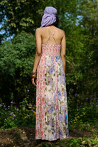 Back view of Carey Jumpsuit Women's multicolour Viscose Lurex Georgette jumpsuit featuring a romantic pink and mauve multi-printed jacquard design with a flattering flowing silhouette, styled for date nights, summer evenings, festive gatherings and day-to-night occasions.