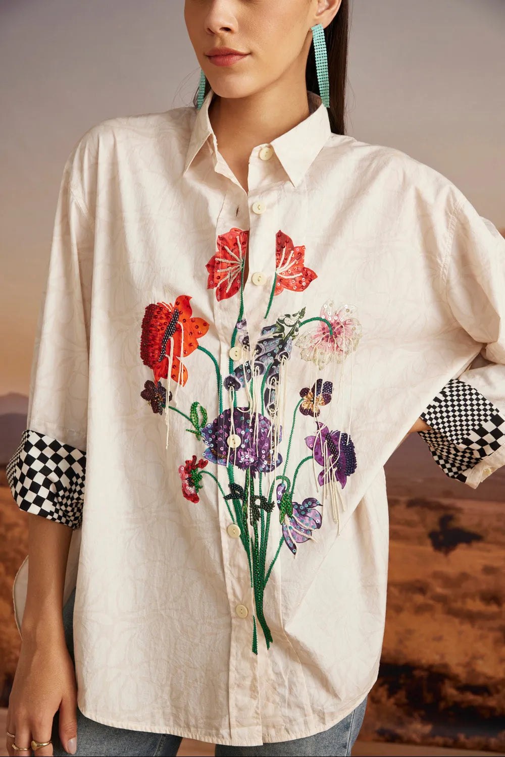 Closeup look of Chiara Shirt women's beige cotton poplin shirt with a relaxed free-size silhouette and intricate thread and bead detailing, styled for summer outings, brunches, festive daytime gatherings and elevated casual occasions.