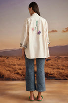 Back view of Chiara Shirt women's beige cotton poplin shirt with a relaxed free-size silhouette and intricate thread and bead detailing, styled for summer outings, brunches, festive daytime gatherings and elevated casual occasions.
