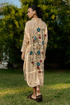 Dani Embroidered Shift Dress women's beige rayon midi dress featuring a vintage newspaper-inspired floral placement print, relaxed shift silhouette and timeless design, styled for summer brunches, vacation outings, creative daytime events and casual gatherings.