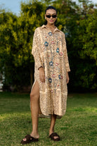 Dani Embroidered Shift Dress women's beige rayon midi dress featuring a vintage newspaper-inspired floral placement print, relaxed shift silhouette and timeless design, styled for summer brunches, vacation outings, creative daytime events and casual gatherings.