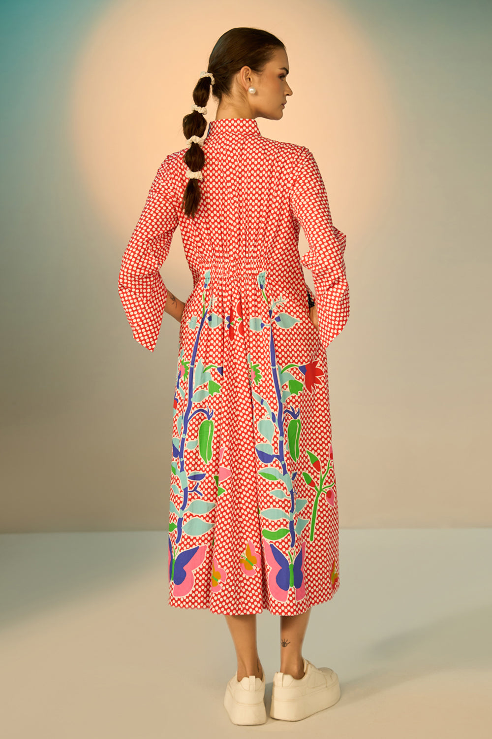 Back view of Daria Embroidered Maxi Dress women's maxi dress featuring classic polka dots, vibrant embroidered detailing and a structured shirt-style silhouette, styled for vacation brunches, creative daytime events, summer outings and statement everyday fashion.
