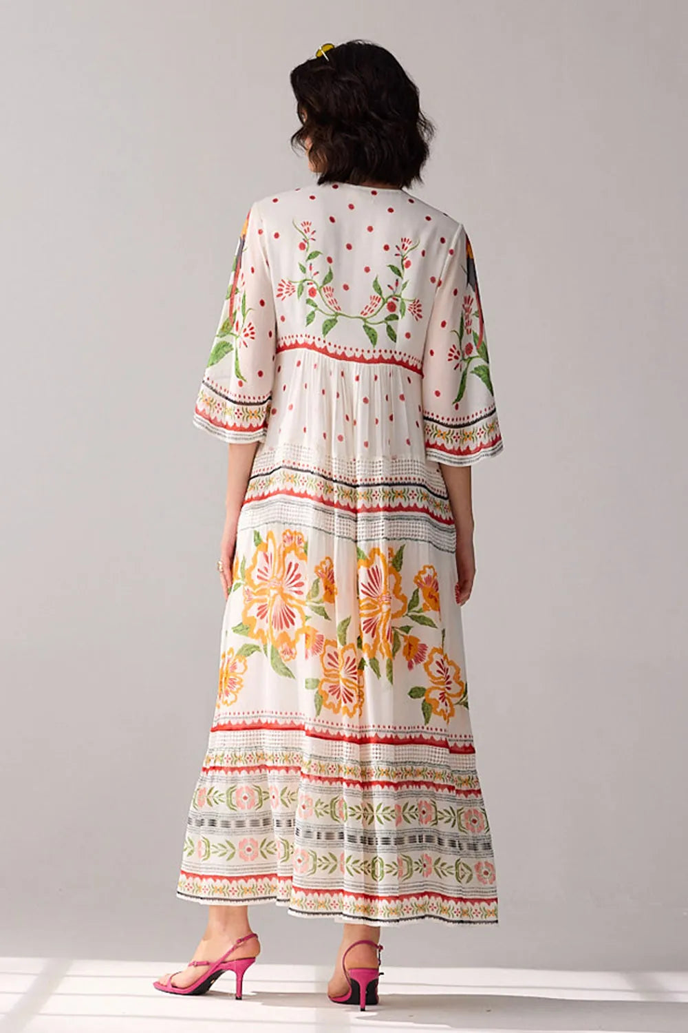 Back view of Delilah Embroidered Maxi Dress women's ivory viscose georgette maxi dress featuring a beautifully embroidered neckline with delicate thread and bead detailing, an elegant flowing silhouette and airy finish, styled for summer holidays, resort dinners, garden parties and special occasions.