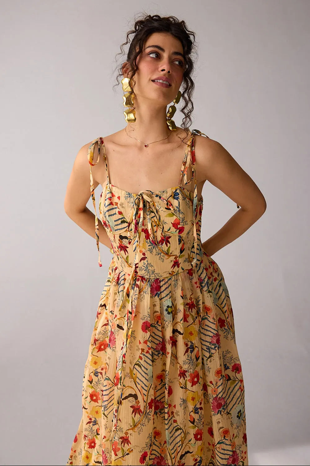 Dixie Dress women's beige chiffon maxi dress featuring a corset-fitted bodice, an elegant flowing skirt and an adjustable smocked back for a flattering fit, styled for summer getaways, resort dinners, luncheons and special occasions.