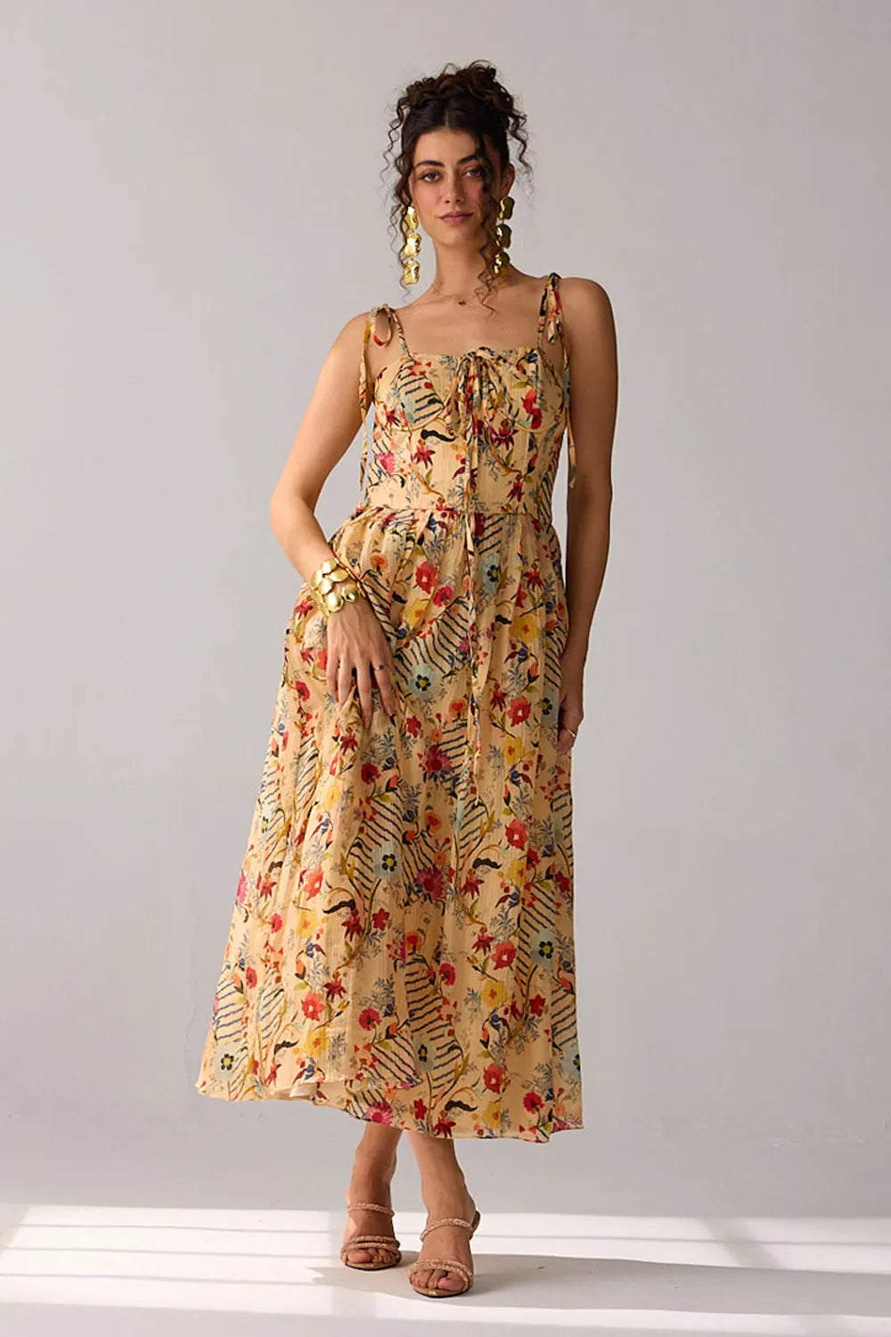 Dixie Dress women's beige chiffon maxi dress featuring a corset-fitted bodice, an elegant flowing skirt and an adjustable smocked back for a flattering fit, styled for summer getaways, resort dinners, luncheons and special occasions.