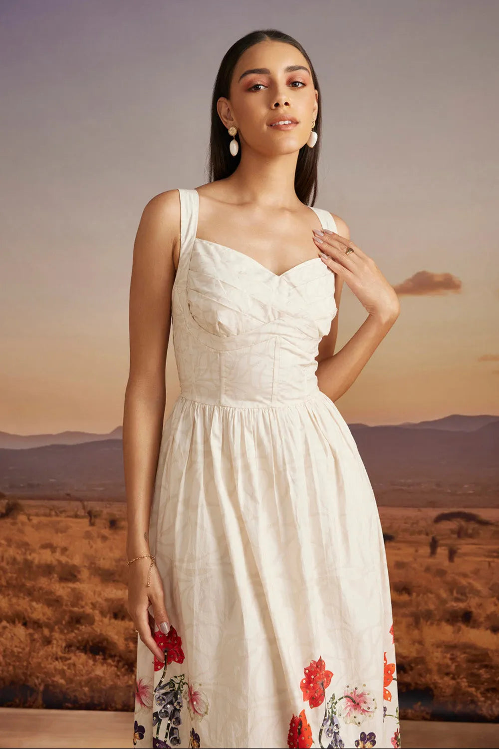 Emery Dress women's beige cotton dress featuring a sweetheart neckline, delicate bead detailing and a floral print with a feminine 50-inch silhouette, styled for summer brunches, resort vacations, garden parties and special occasions.