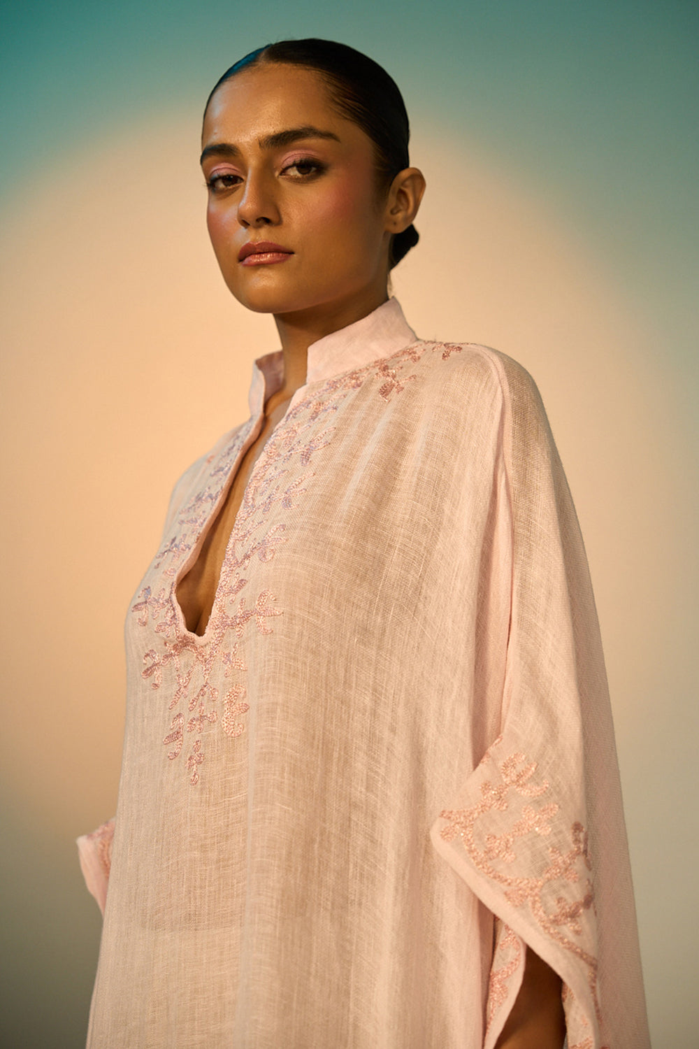 Ibiza Linen Coverup women's pink linen cover-up featuring intricate zari paisley embroidery along the neckline and sleeves, an open-front flowing silhouette and a separate detachable slip, designed for layering over swimwear during beach holidays, resort vacations and elegant summer getaways.