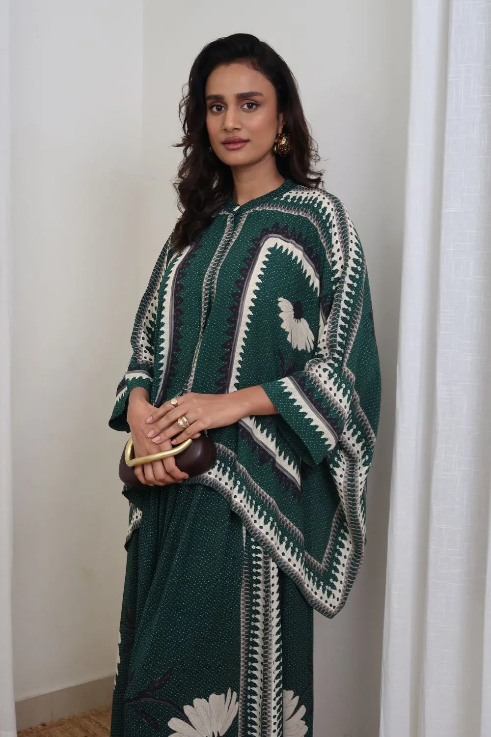 Inessa Cape and Pants Set women's emerald green double georgette co-ord featuring a geometric printed cape blouse with a fluid, flowing silhouette and matching relaxed-fit pants, styled for resort holidays, summer brunches, destination celebrations and sophisticated day-to-evening occasions.
