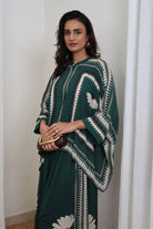 Inessa Cape and Pants Set women's emerald green double georgette co-ord featuring a geometric printed cape blouse with a fluid, flowing silhouette and matching relaxed-fit pants, styled for resort holidays, summer brunches, destination celebrations and sophisticated day-to-evening occasions.
