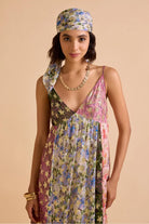 Closeup look of Irida Spaghetti Dress women's multicolour Viscose Lurex Georgette maxi dress featuring a jacquard printed colour-blocked design, delicate spaghetti straps and shimmering fabric with a flowing silhouette, styled for resort vacations, festive evenings, holiday getaways and special occasions.