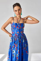 Closeup look of Isla Spaghetti Dress women's blue satin chiffon maxi dress featuring delicate spaghetti straps, a sleek flowing silhouette and minimal elegant styling, designed for resort evenings, intimate dinners, summer holidays and destination celebrations.