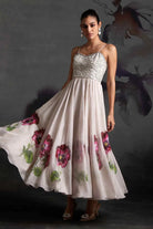 Ivina Corset Dress women's ivory organza maxi dress featuring a structured corset bodice, delicate sequin embellishments over a floral print and a flowing floor-length silhouette, styled for resort celebrations, summer weddings, formal gatherings and special occasions.