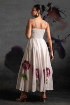 Back view of Ivina Corset Dress women's ivory organza maxi dress featuring a structured corset bodice, delicate sequin embellishments over a floral print and a flowing floor-length silhouette, styled for resort celebrations, summer weddings, formal gatherings and special occasions.