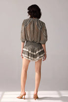 Back view of Keira Blouse women's statement blouse featuring a contemporary silhouette and distinctive design details, styled for summer brunches, resort outings, casual celebrations and elevated everyday wear.