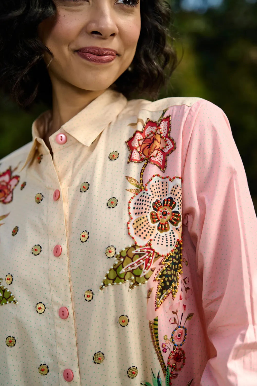 Closeup look of Keyla Shirt women's pink and cream cotton shirt featuring a bold colour-blocked floral print, vibrant contrasting hues and a relaxed longline silhouette, styled for summer holidays, resort outings, casual brunches and statement everyday dressing.