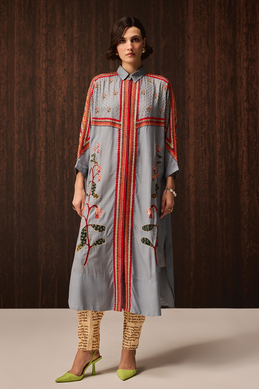 Kori Embroidered Shirt With Pants women's pale blue Double Georgette co-ord set featuring an oversized shirt with tonal embroidery and matching newspaper-print jogger pants, combining a relaxed silhouette with an artistic statement design, styled for airport looks, resort lounging, travel days and casual outings.