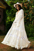 Kriti Sanon wearing the Femi Cape With Shorts, a women's ivory chiffon co-ord set featuring a flowing cape with delicate lace detailing and matching shorts with lace accents, styled for beach holidays, resort vacations, poolside gatherings and elegant summer getaways.
