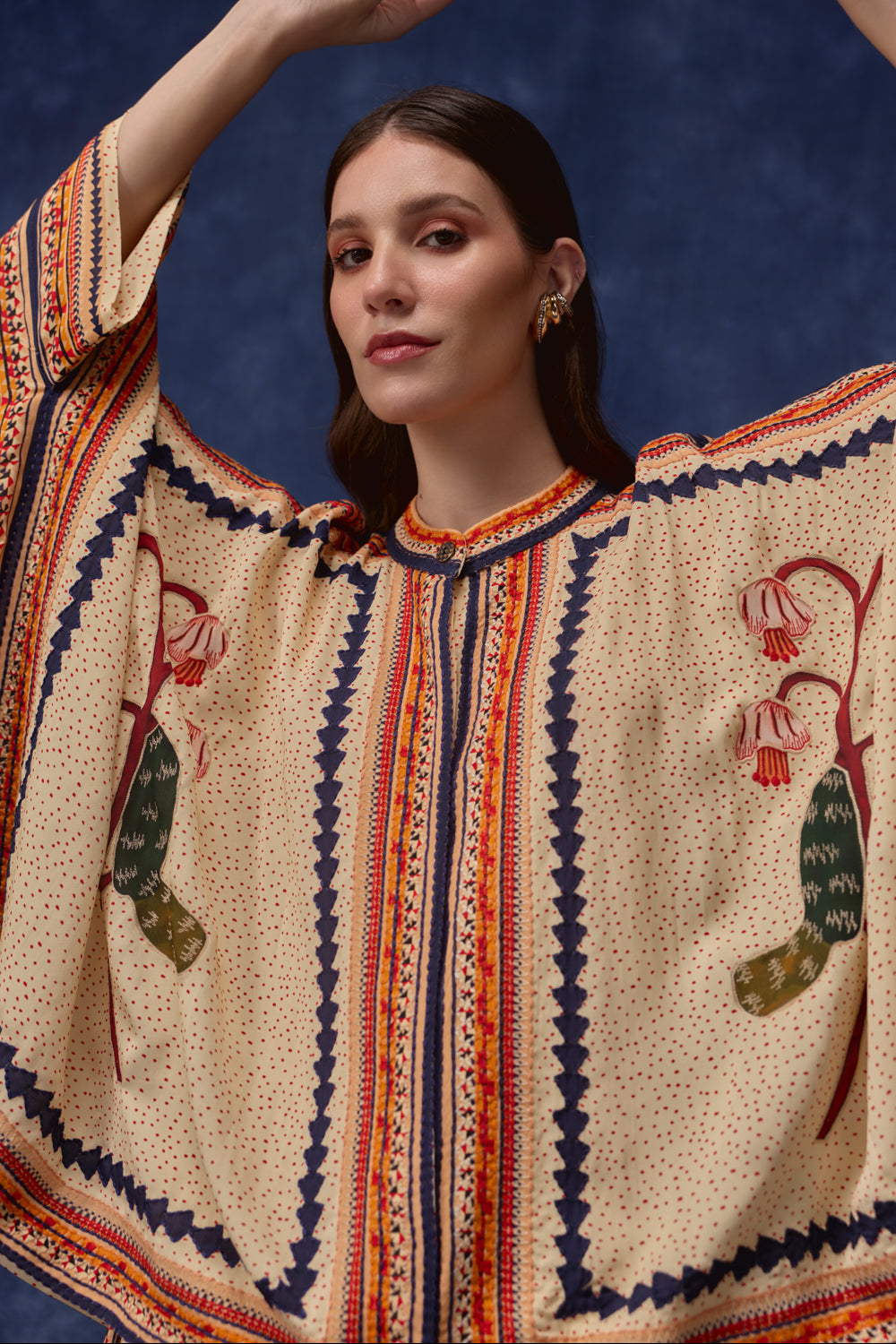 Closeup look of Lana Embroidered Cape With Pants women's co-ord set featuring a flowing embroidered cape paired with matching pants, combining intricate detailing with an elegant relaxed silhouette, styled for festive gatherings, resort dinners, destination celebrations and special occasions.
