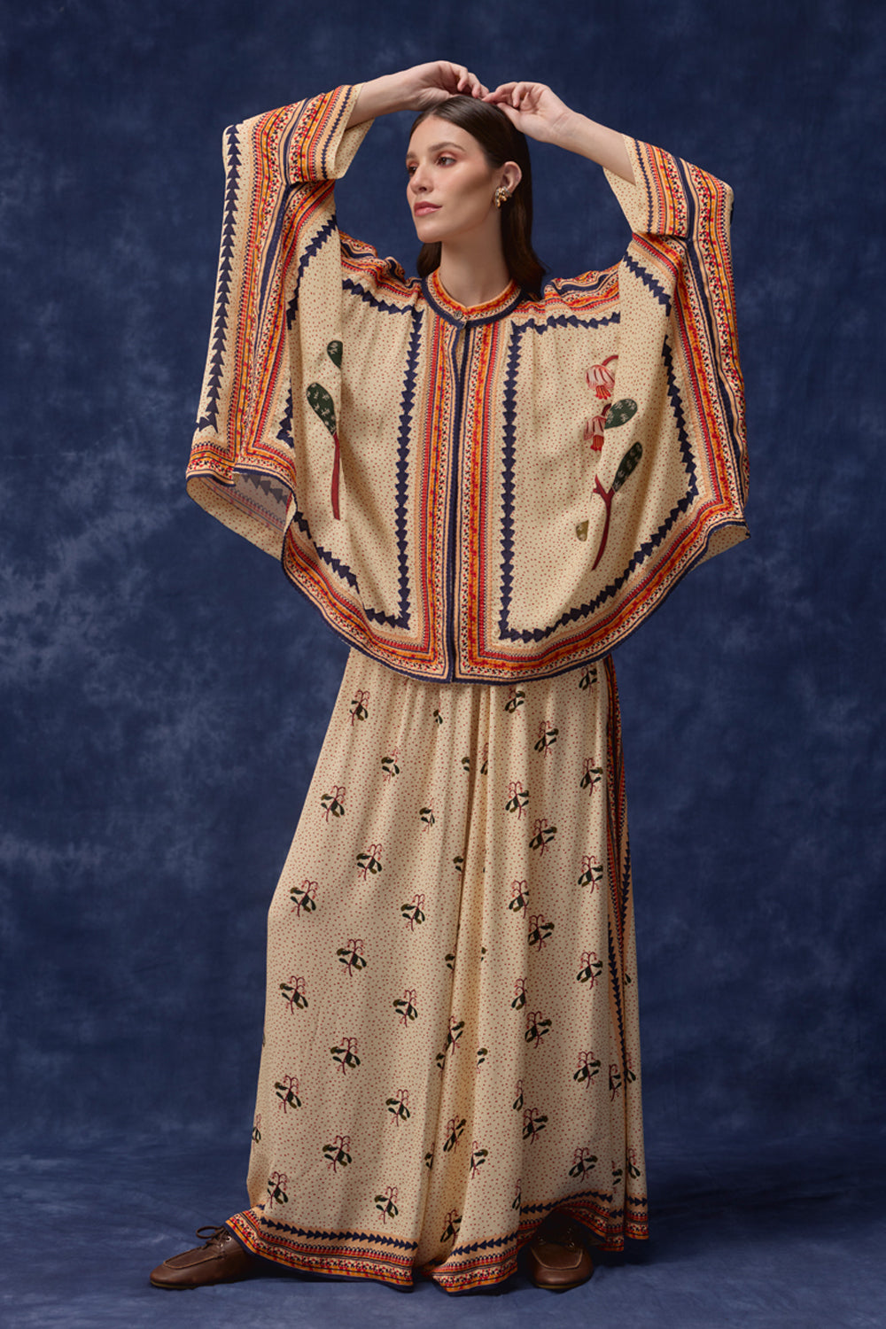 Detailed view of Lana Embroidered Cape With Pants women's co-ord set featuring a flowing embroidered cape paired with matching pants, combining intricate detailing with an elegant relaxed silhouette, styled for festive gatherings, resort dinners, destination celebrations and special occasions.