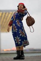 Larissa D'Sa wearing the Tatiana Tier Maxi Dress, a women's maxi dress featuring a flowing tiered silhouette and statement printed design, styled for resort vacations, summer holidays, destination celebrations and elegant daytime occasions.