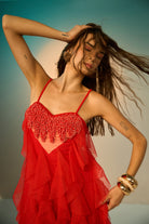 Closeup look of Lexa Embroidered Dress women's red tulle maxi dress featuring dramatic cascading ruffles, delicate spaghetti straps and a statement beaded heart embellishment on the bodice, creating a glamorous flowing silhouette for cocktail parties, evening celebrations, special events and statement occasions.